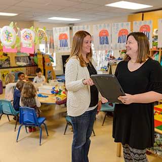 Teachers and children in the child care center
