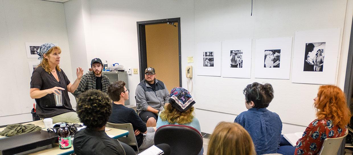 Gallery director Tara Fracalossi in classroom with students
